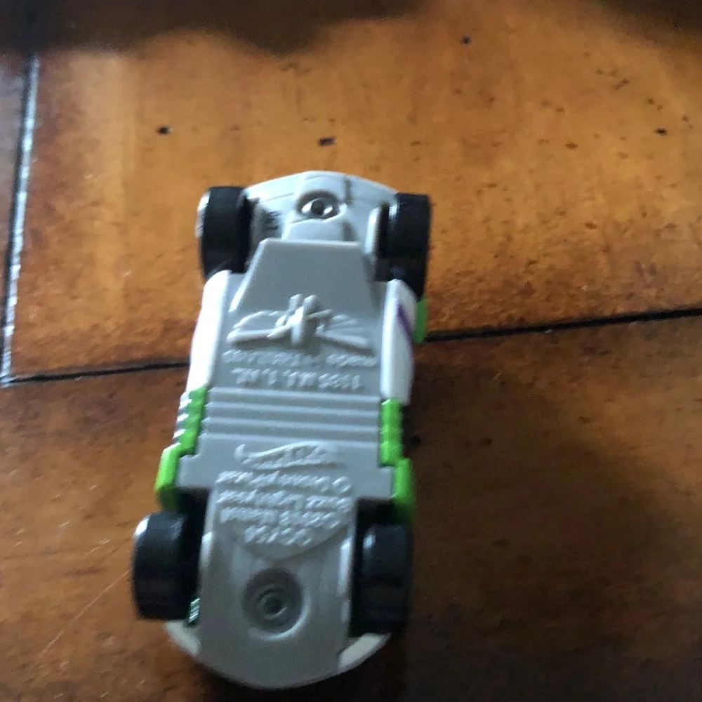 Green Toy Race Car with Purple Accents